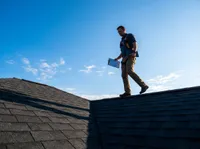 Roof inspector on rooftop
